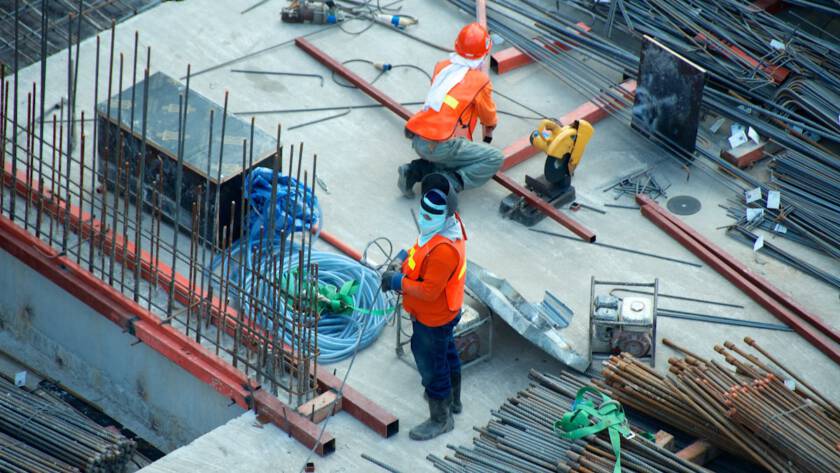 Construction workers on an infrastructure project site.