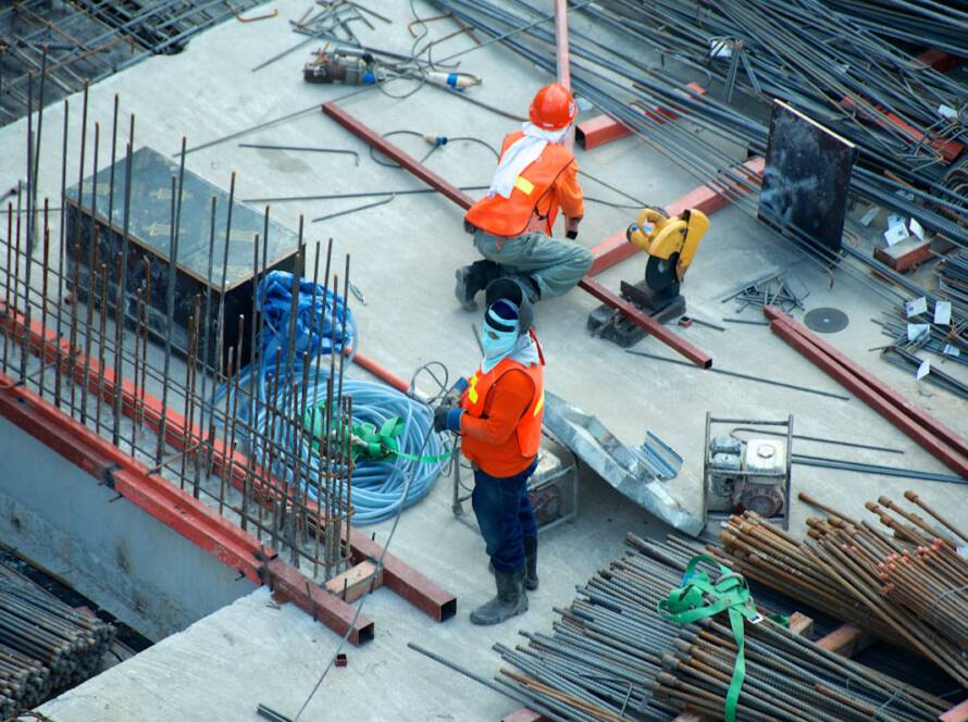 Construction workers on an infrastructure project site.