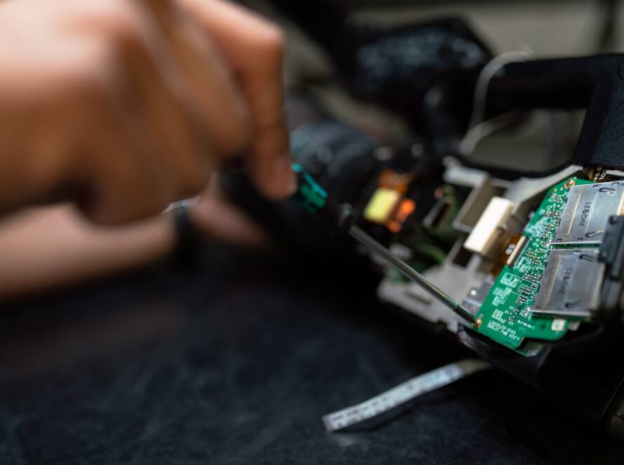Technician working on industrial electrical equipment