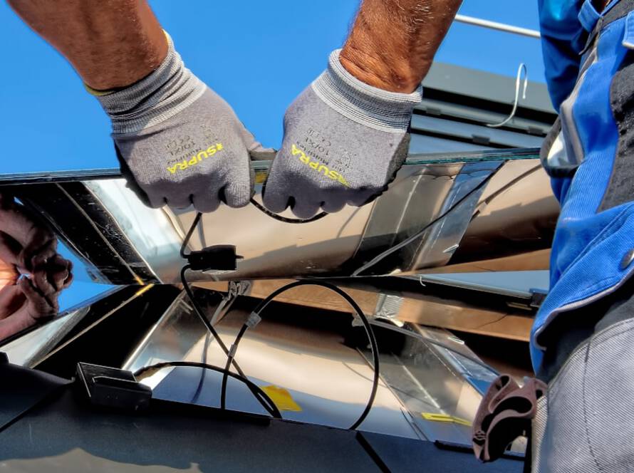 Rooftop solar panels on a large industrial warehouse.